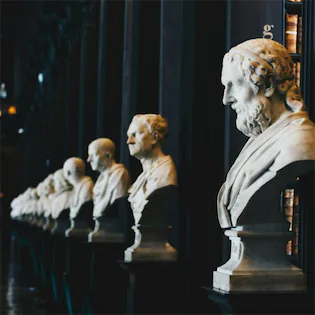 Historic law library with classical busts and legal texts, representing the established legal precedents that protect consumers under California's Lemon Law